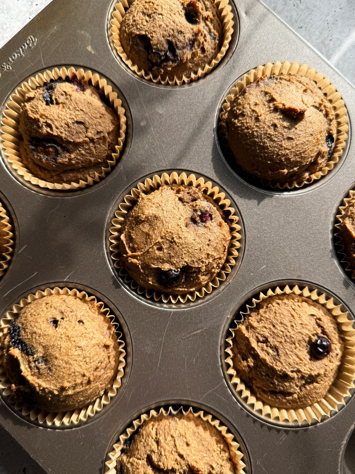 Freshly baked muffins in muffin tin.