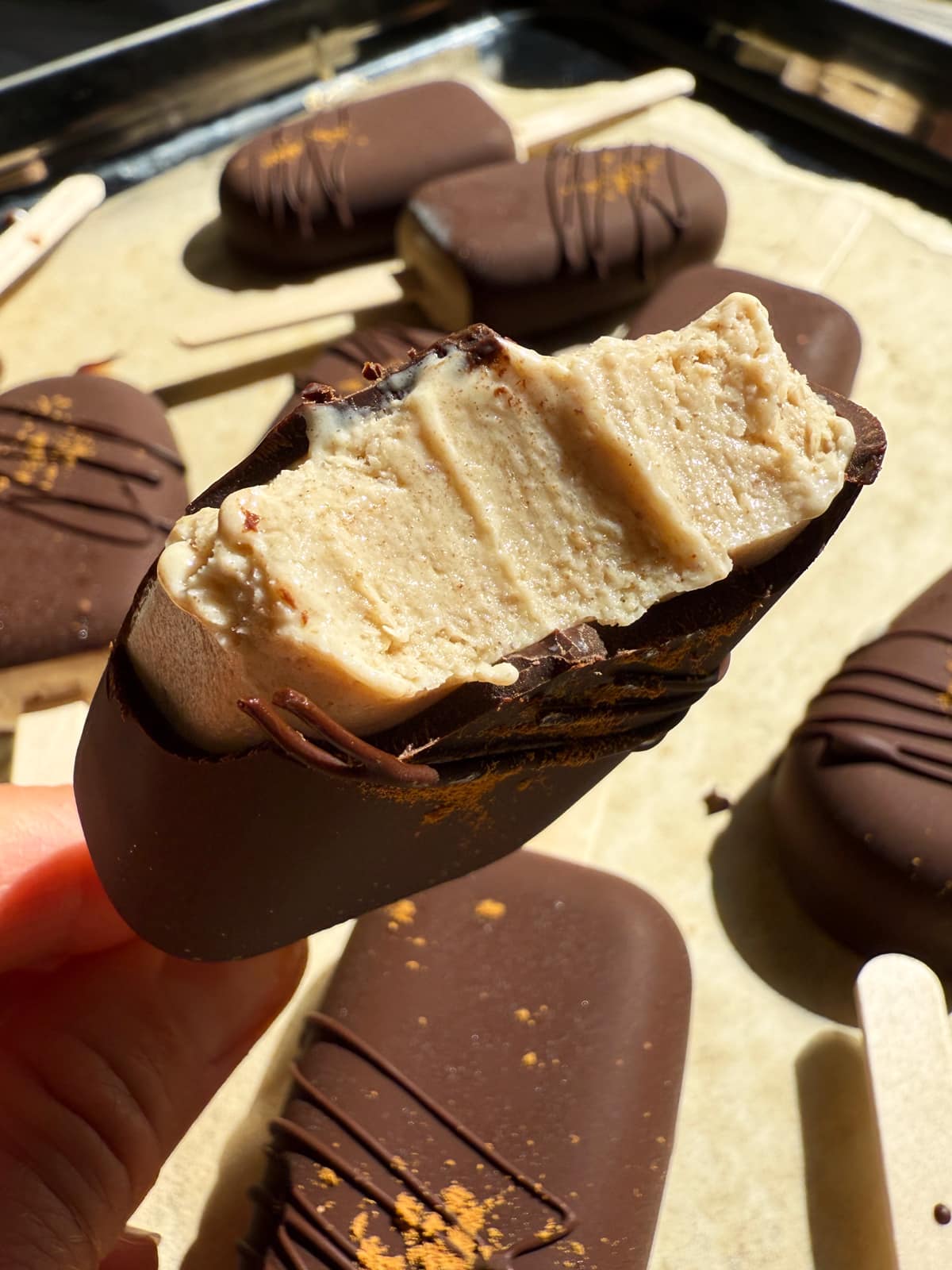 Bite of an ice cream bar to show texture.
