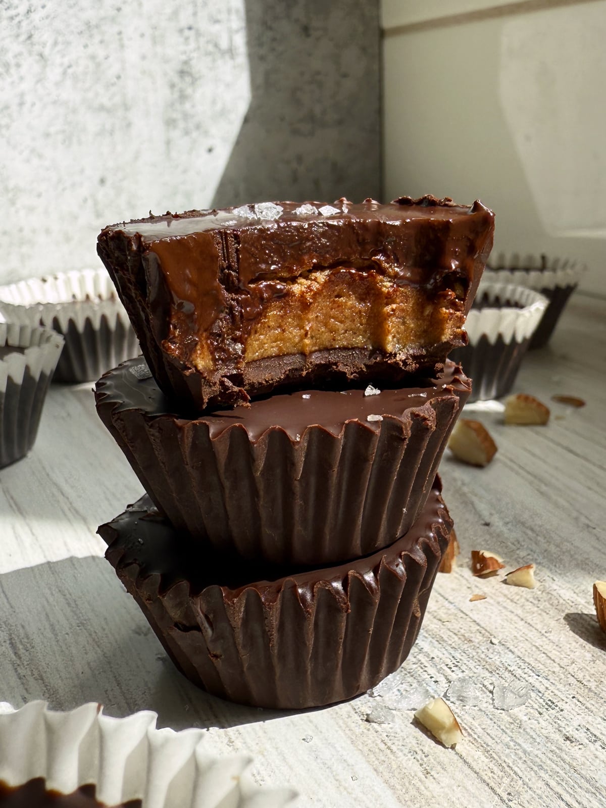Stack of 3 almond butter protein cups.