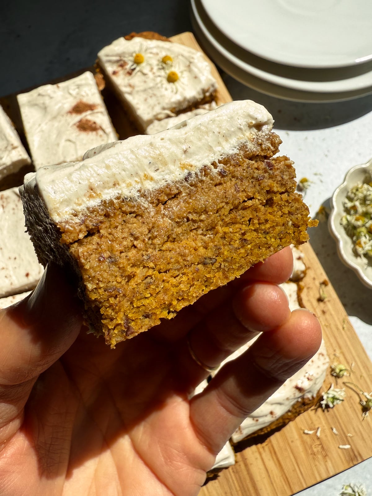 Holding a slice of pumpkin cake.