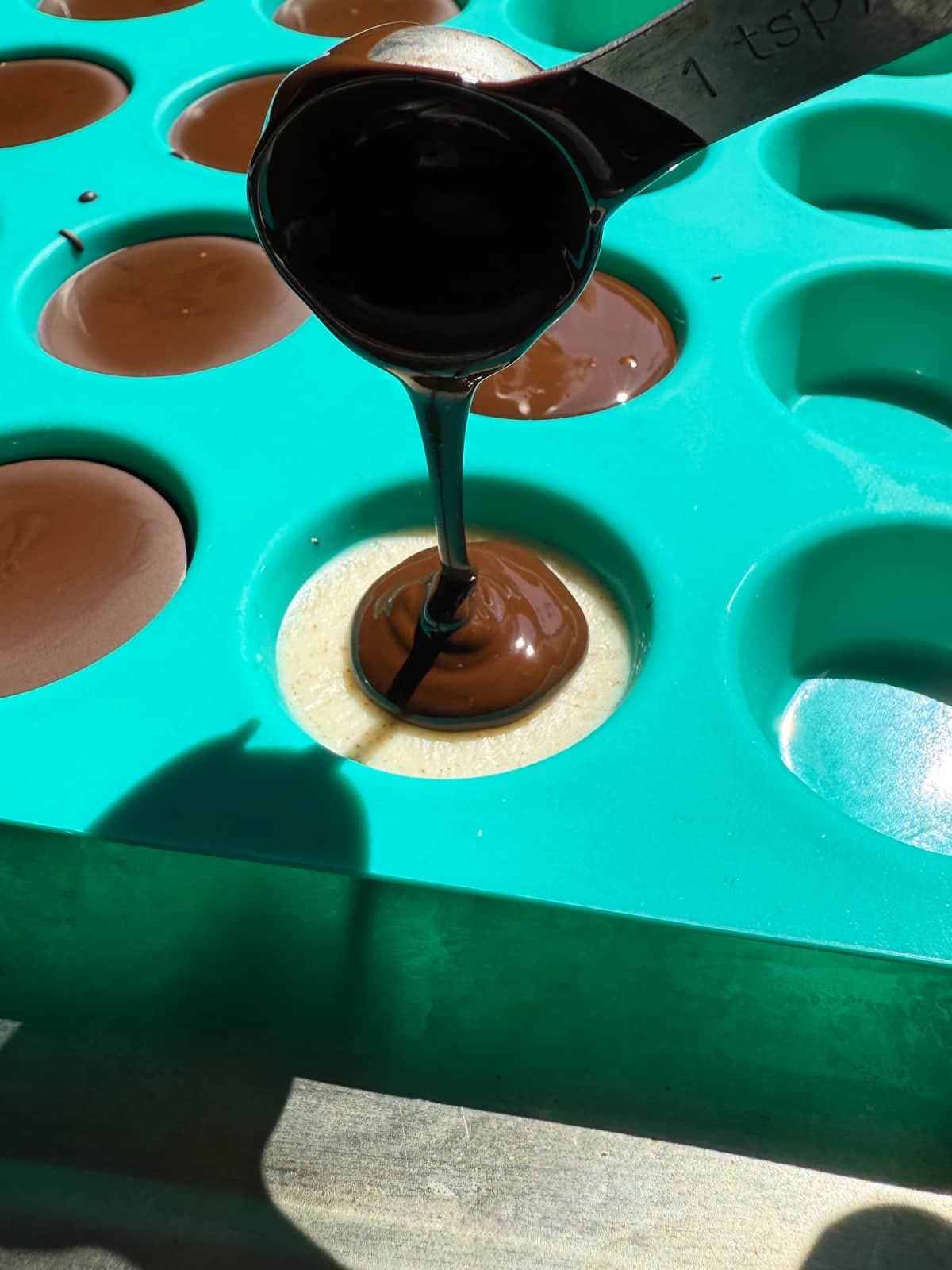 Adding the chocolate topping.