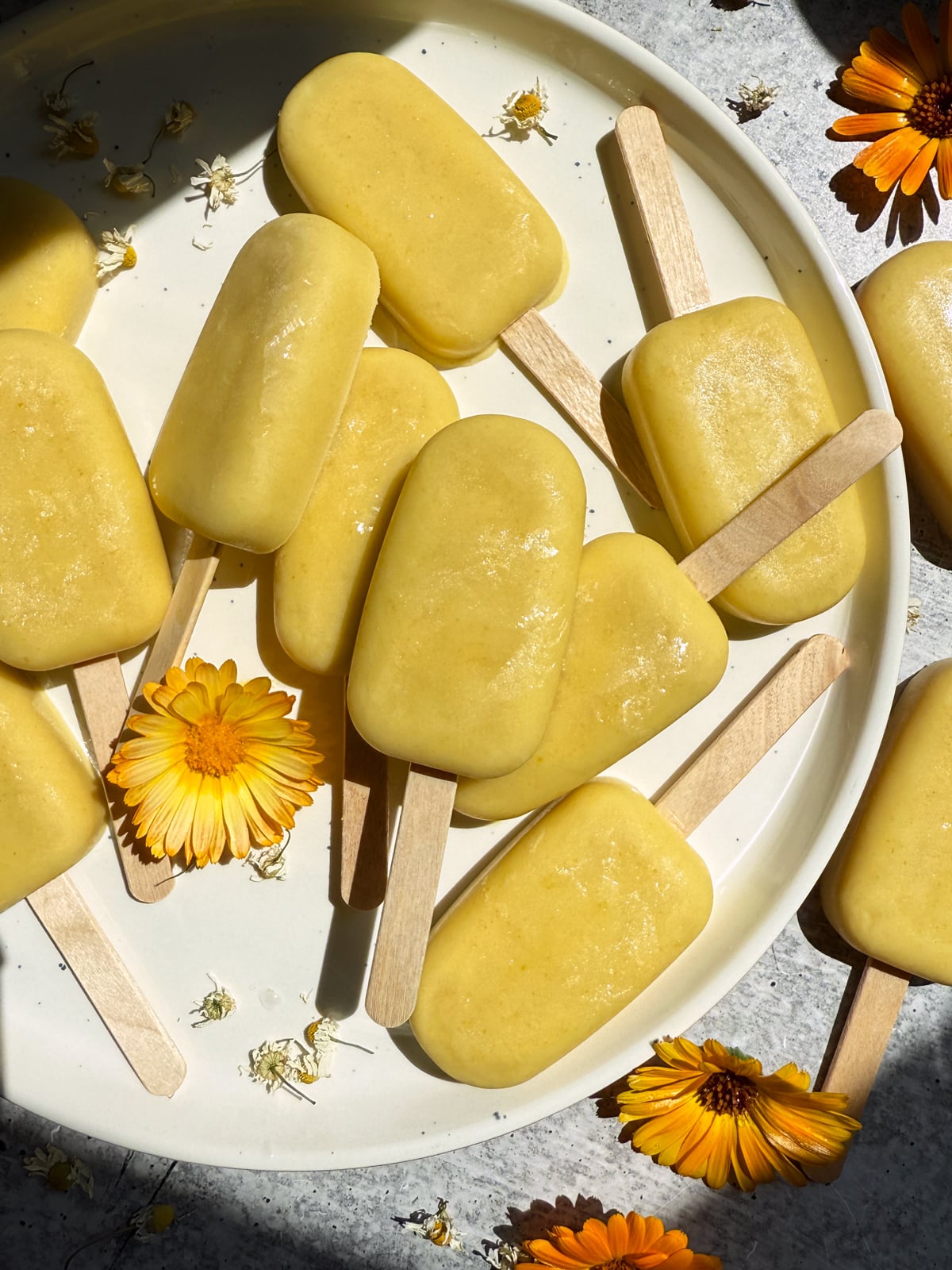 Plate of orange cream ice cream bars.