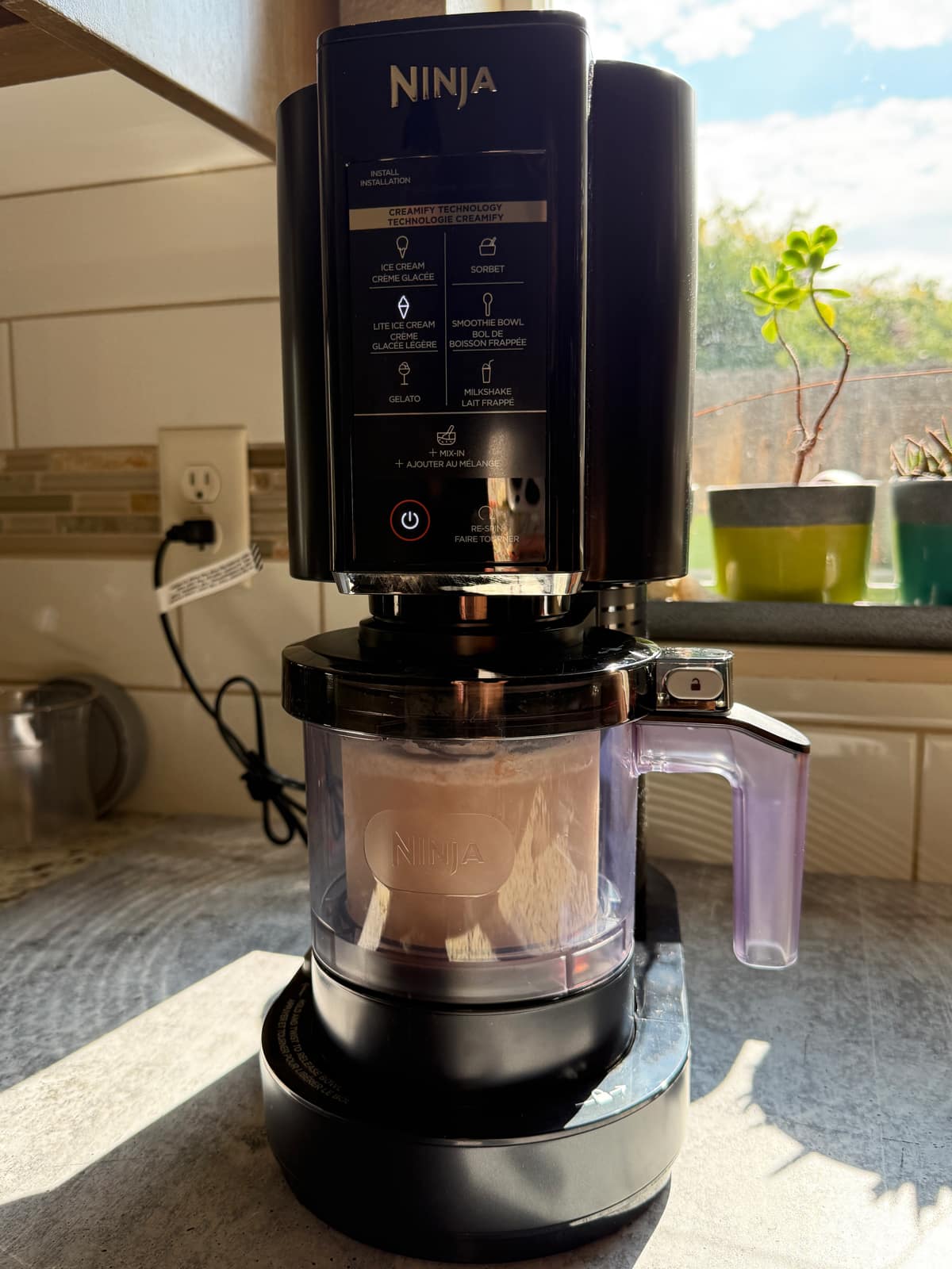 Blending the frozen ice cream in the Ninja Creami.