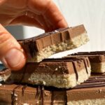 Grabbing a bar from a stack.