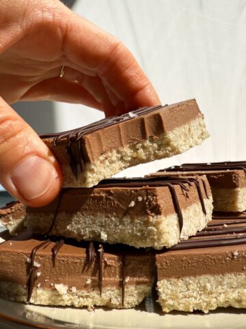 Grabbing a bar from a stack.