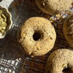 Healthy seed bagels on wire cooling rack.