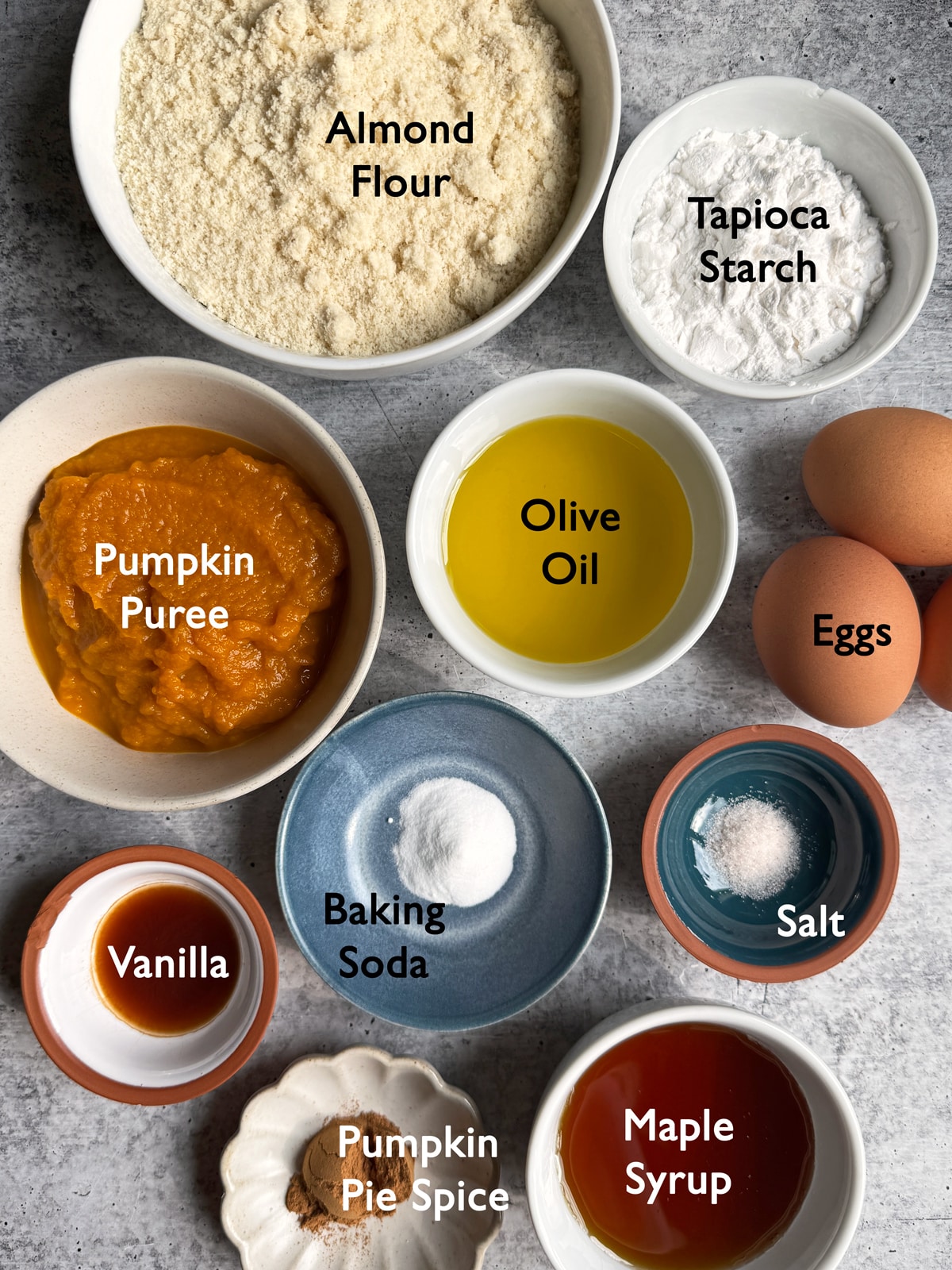 Ingredients needed to make a gluten free olive oil pumpkin loaf.