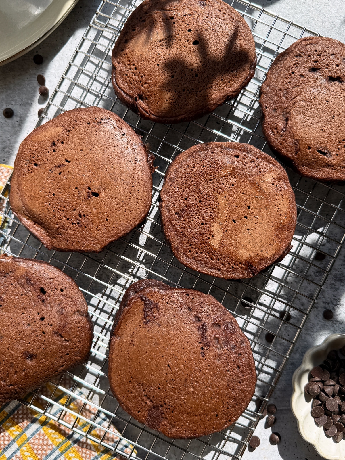 Top view of pancakes cooling on a wire rack.