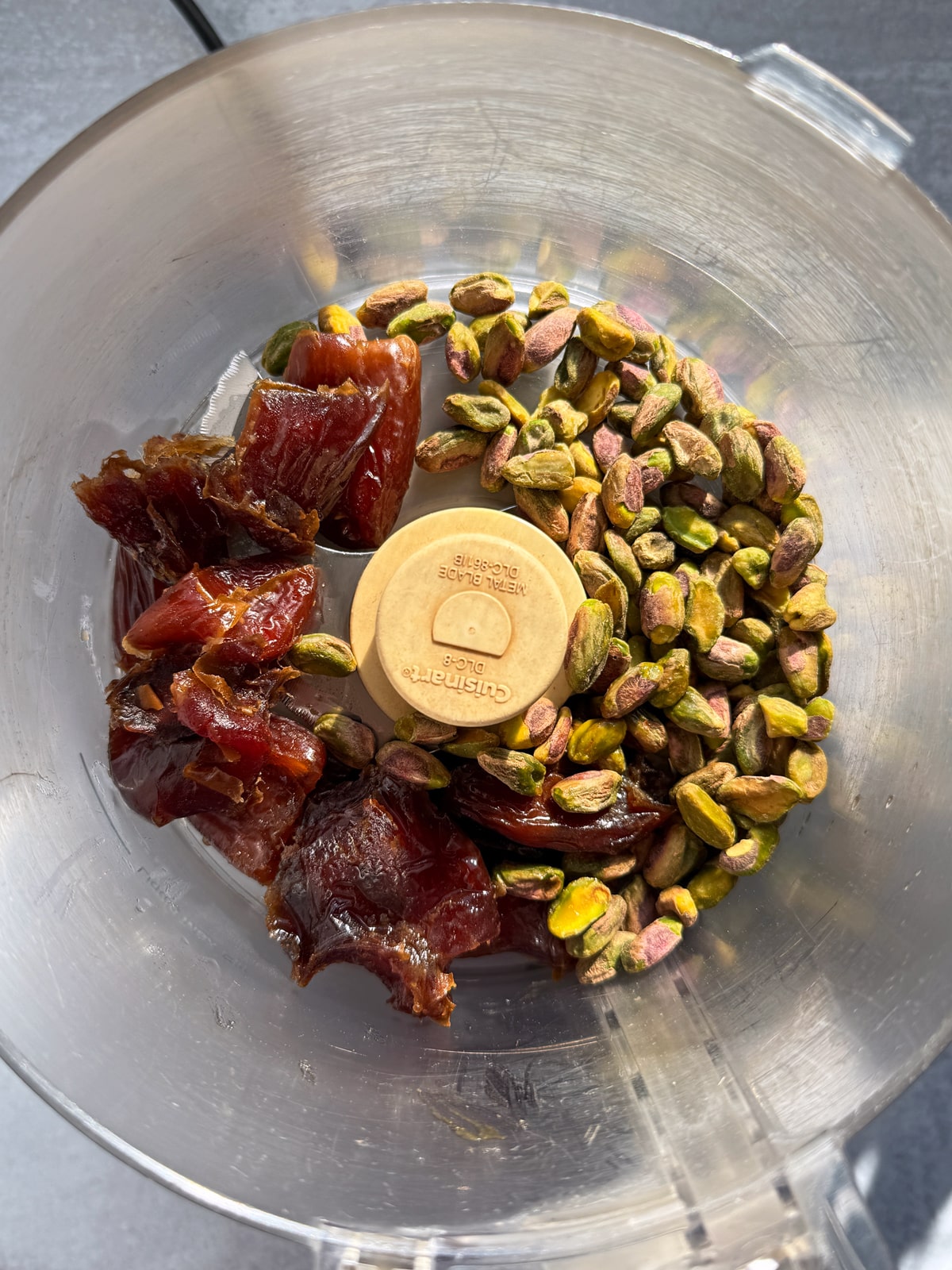 Filling ingredients in food processor.