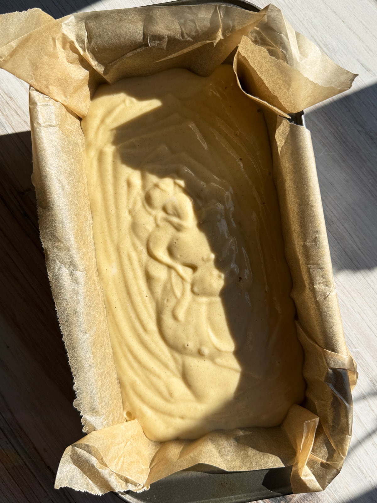 Batter in lined baking pan.