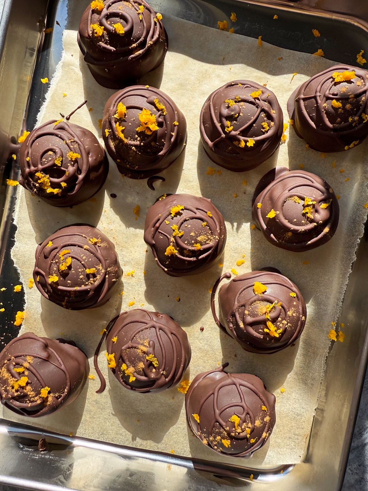 Decorated chocolate orange truffles.