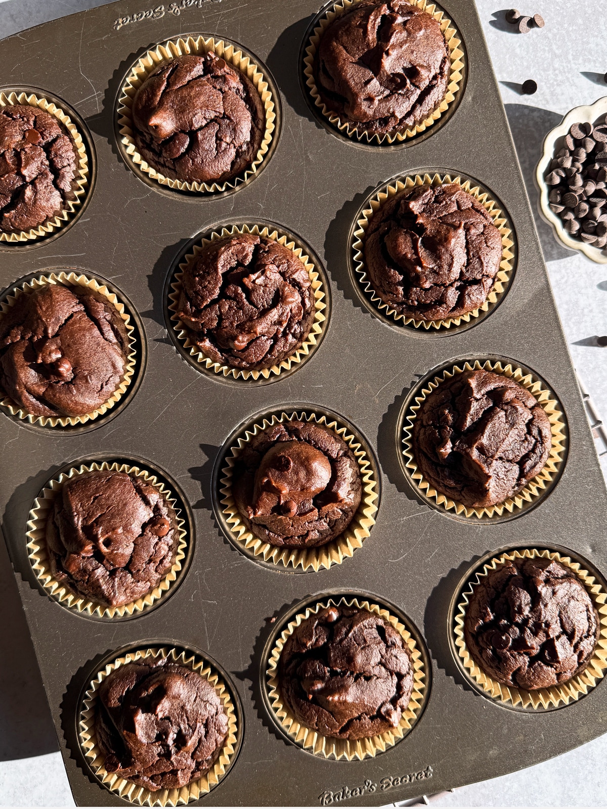 Freshly baked muffins in muffin tin.