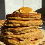 Drizzling maple syrup over the zucchini banana pancakes.