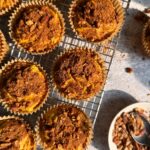 Paleo pumpkin muffins on wire cooling rack.