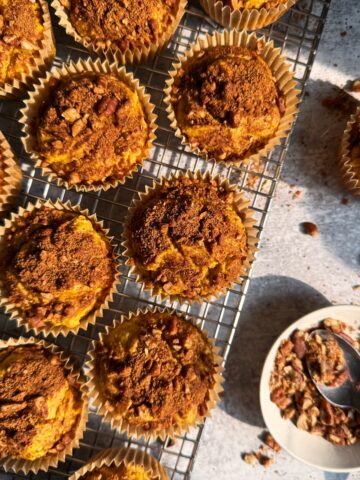 Paleo pumpkin muffins on wire cooling rack.