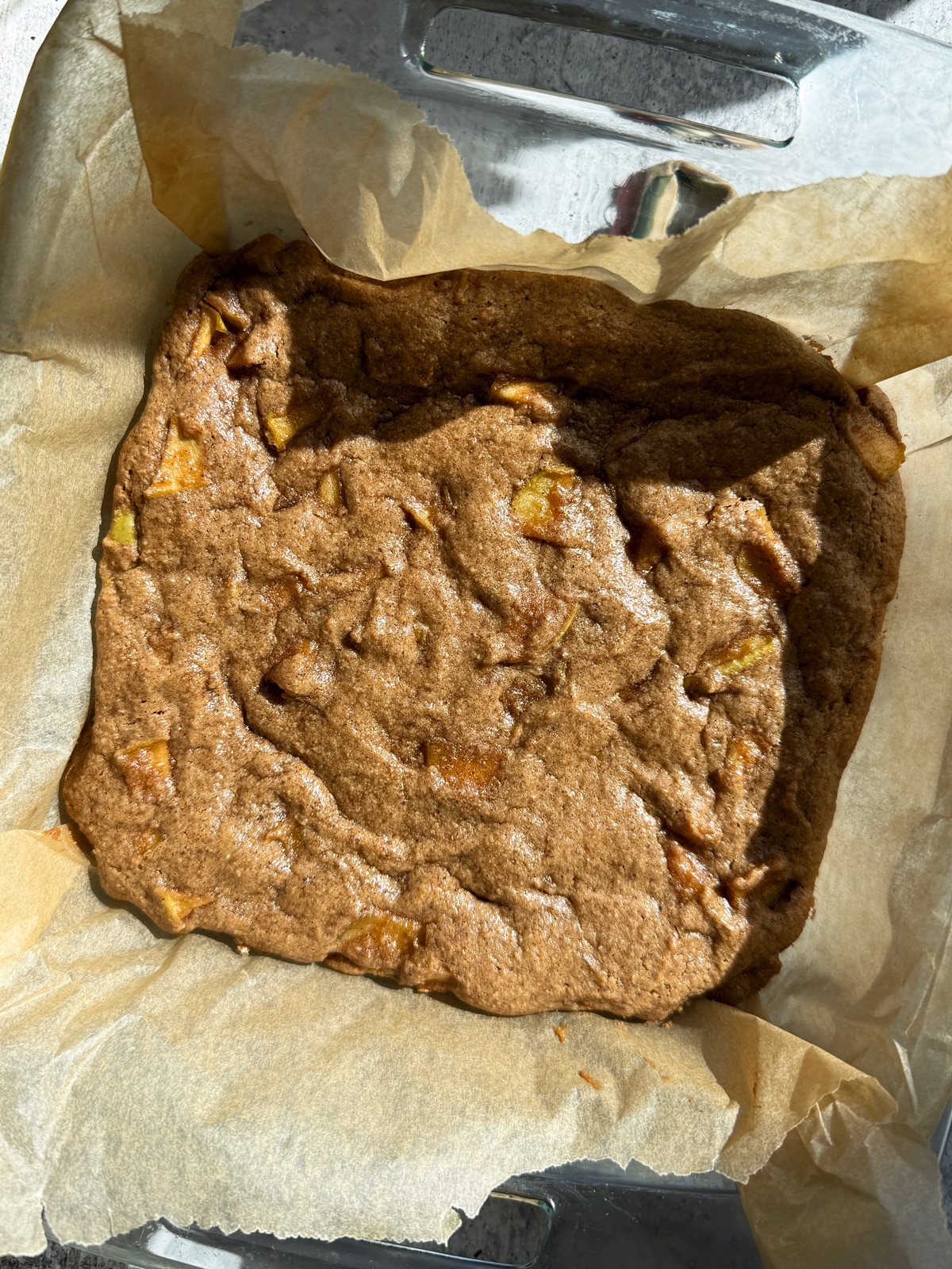 Freshly baked apple blondies in baking dish.