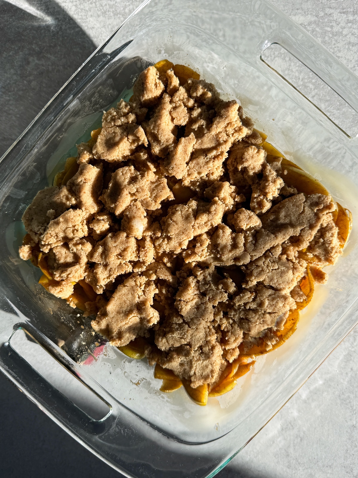 Assembled apple cobbler ready to bake.