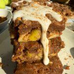 Paleo apple blondies topped with icing.