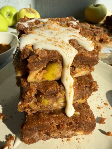 Paleo apple blondies topped with icing.