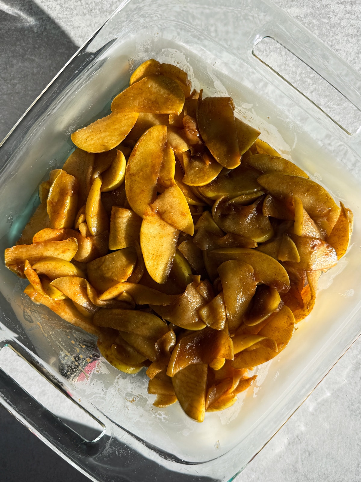 Cooked apples in 8x8 inch baking dish.