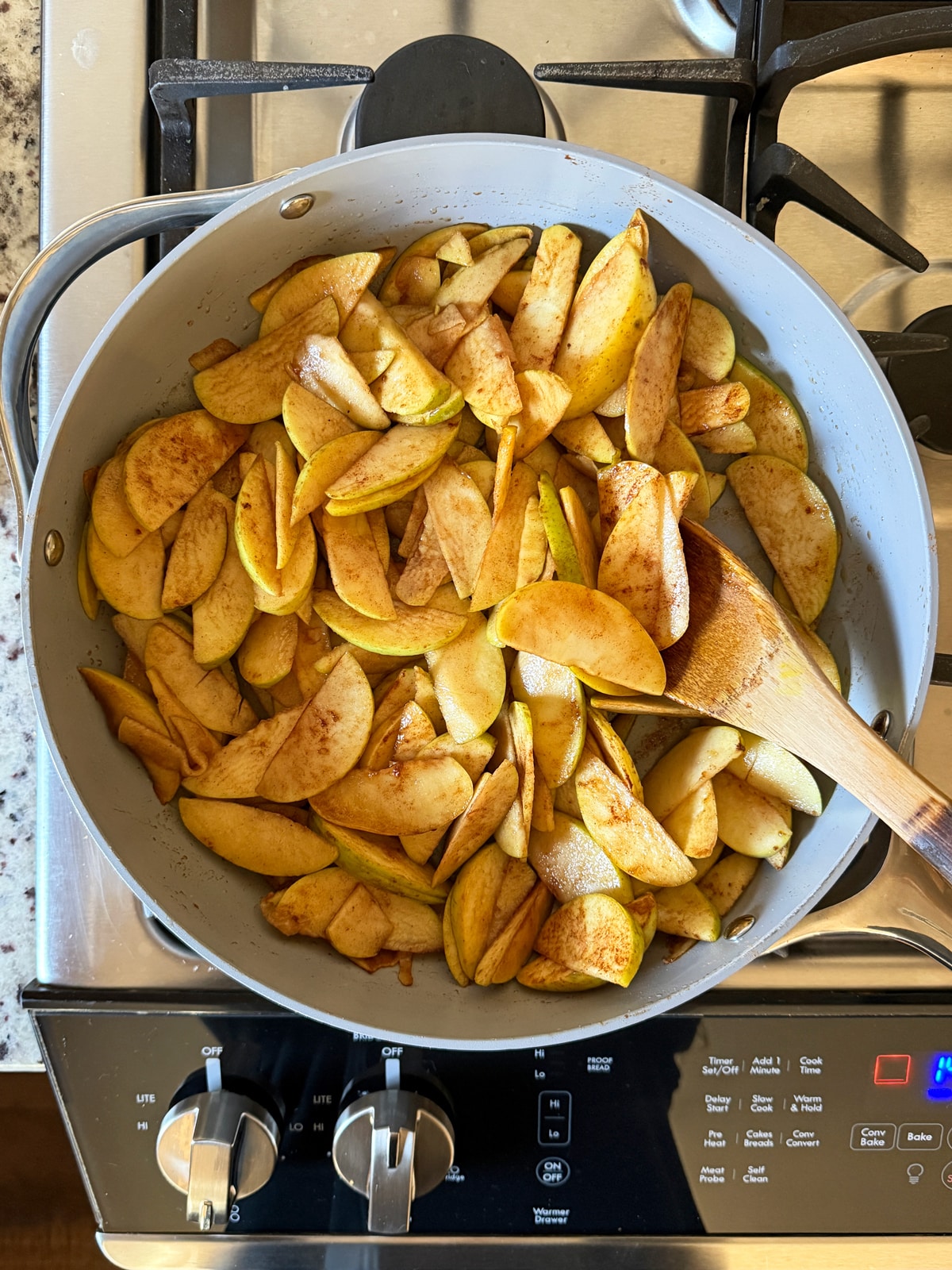 Cooking the apples on the stovetop.