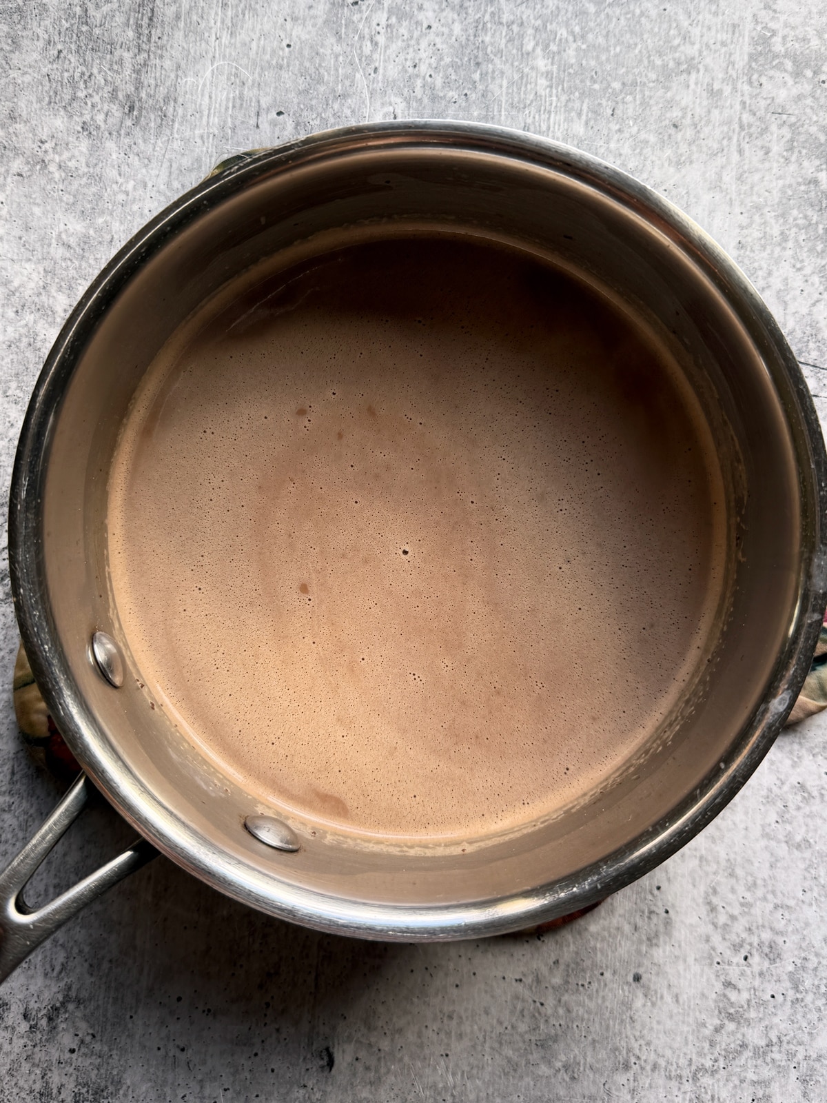 Hot chocolate in saucepan.