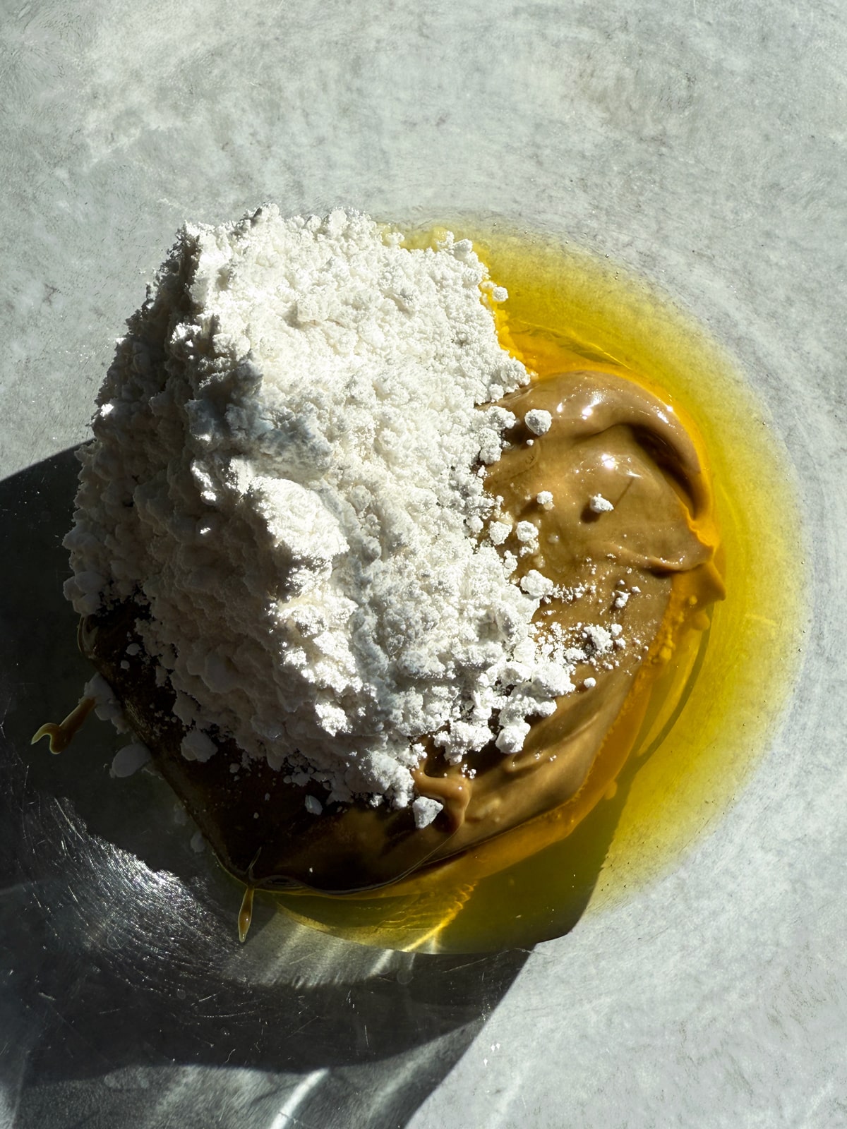 Combing the sunbutter, powdered monk fruit and cacao butter.