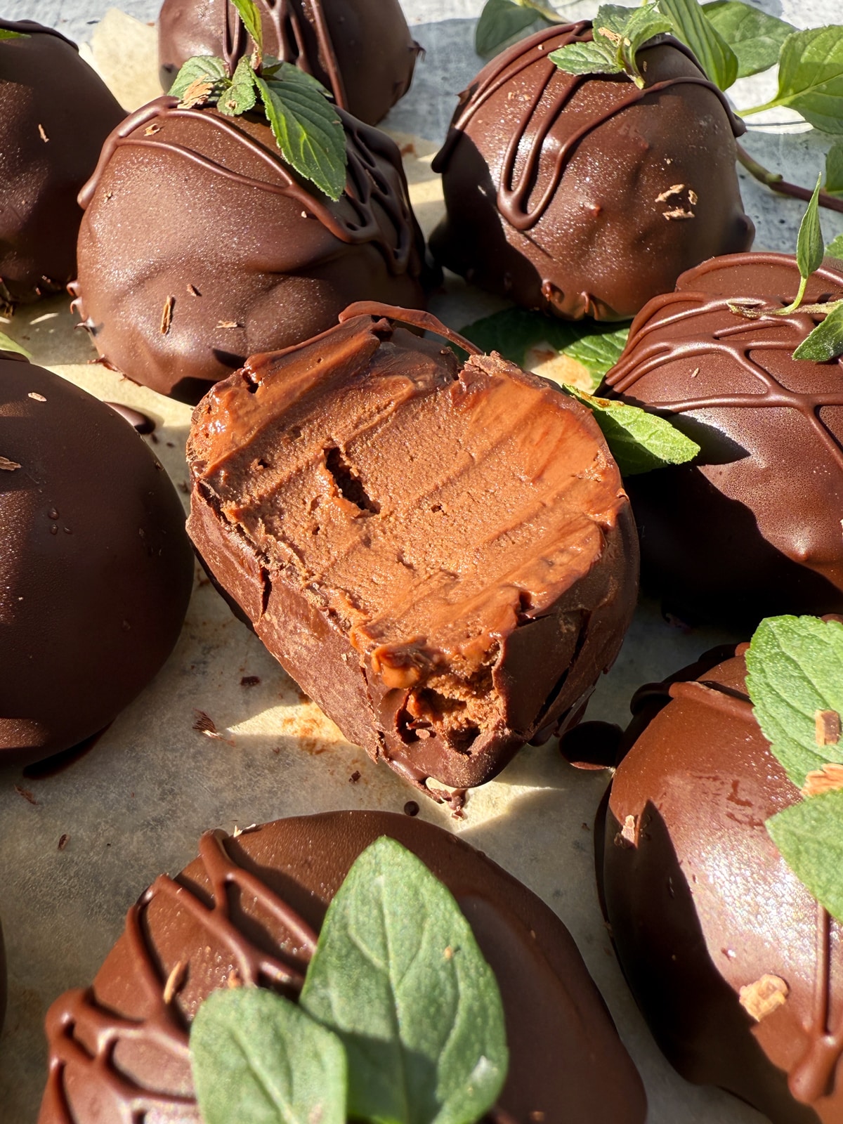 Bite of a truffle to show the inside texture.