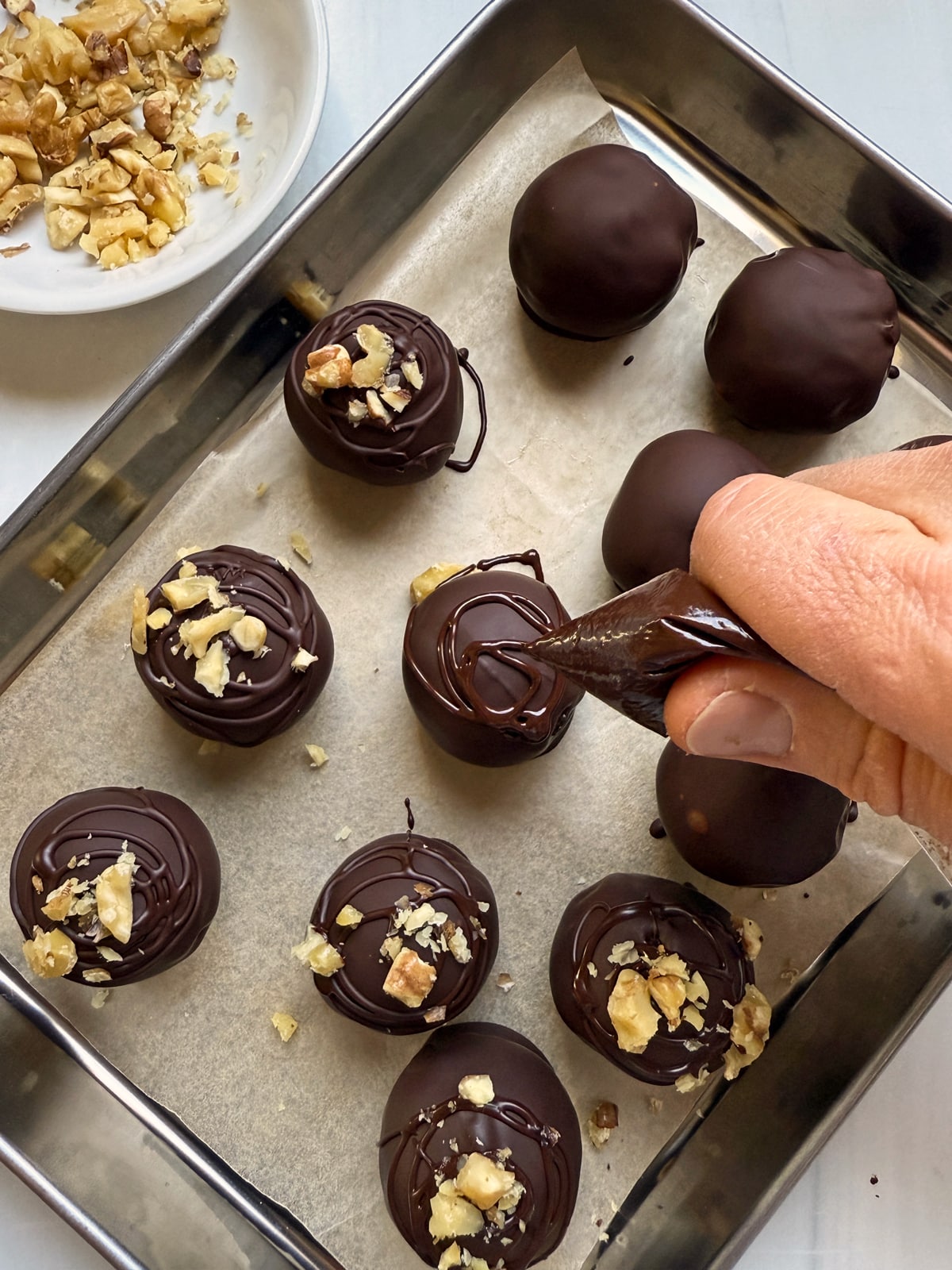 Decorating the truffles.
