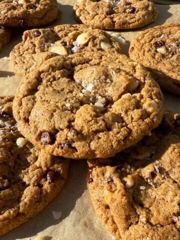 Paleo macadamia nut cookies topped with flaked salt.