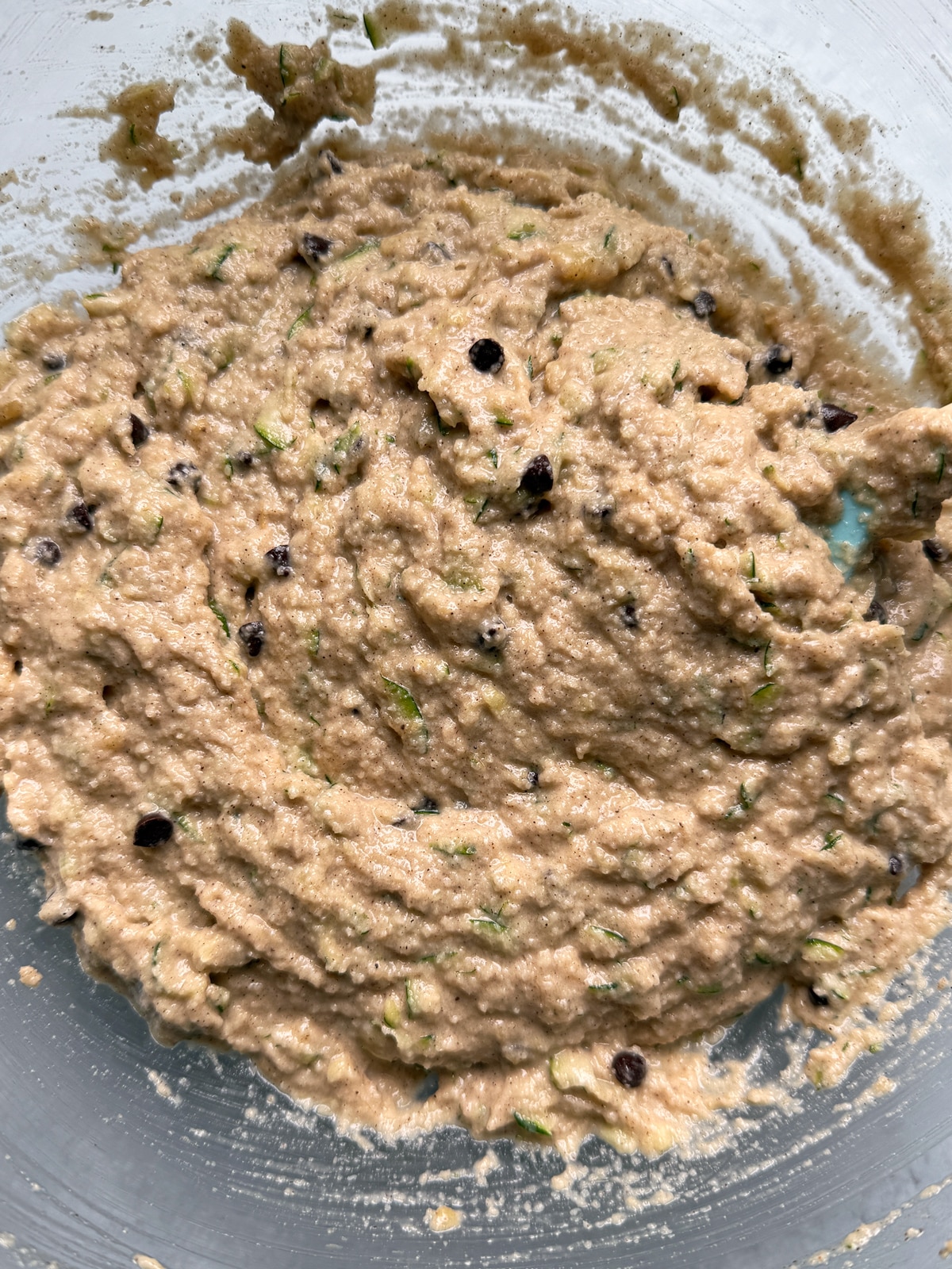 Batter for zucchini banana bread in mixing bowl.