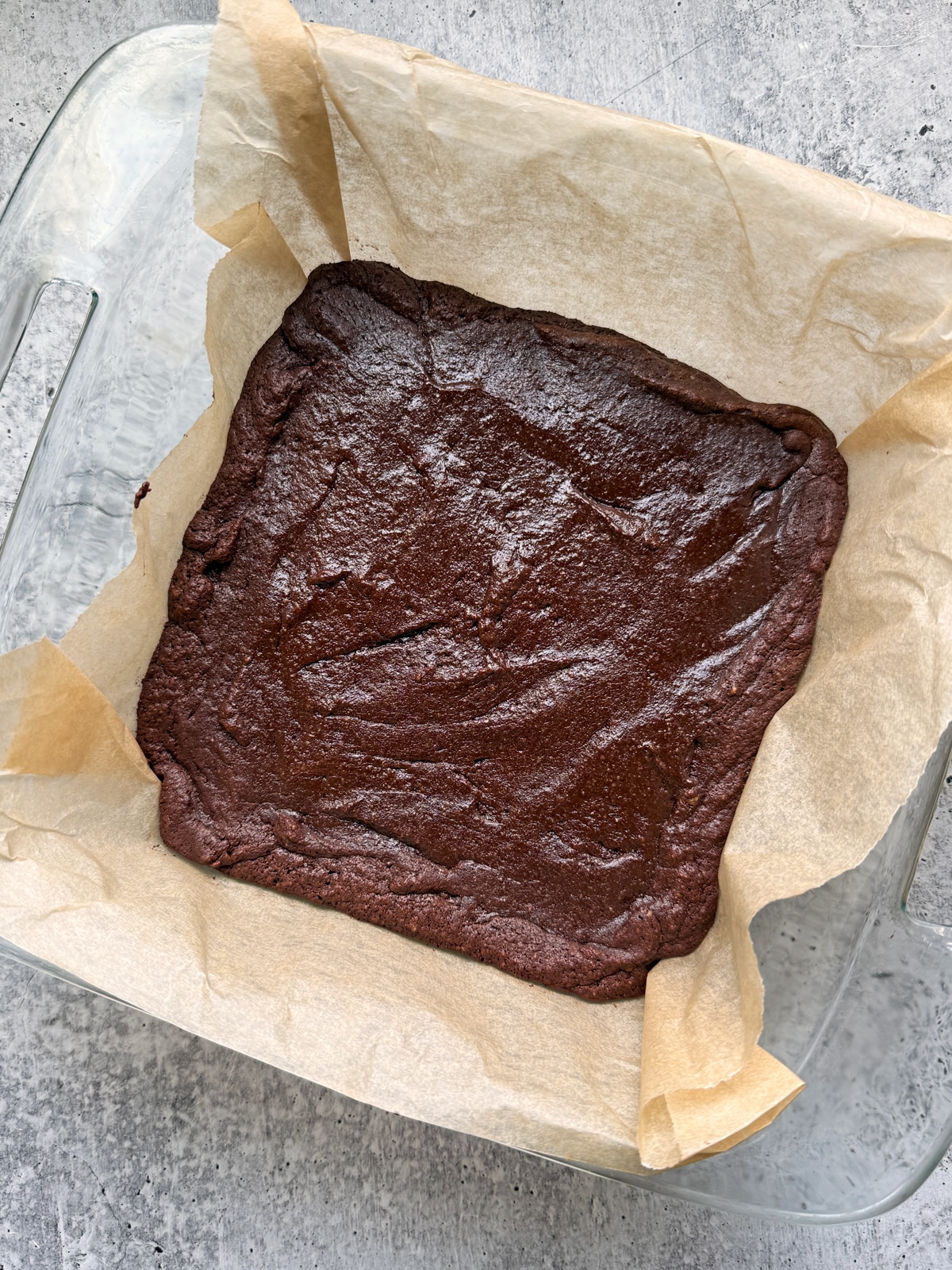 Baked brownies in baking dish.