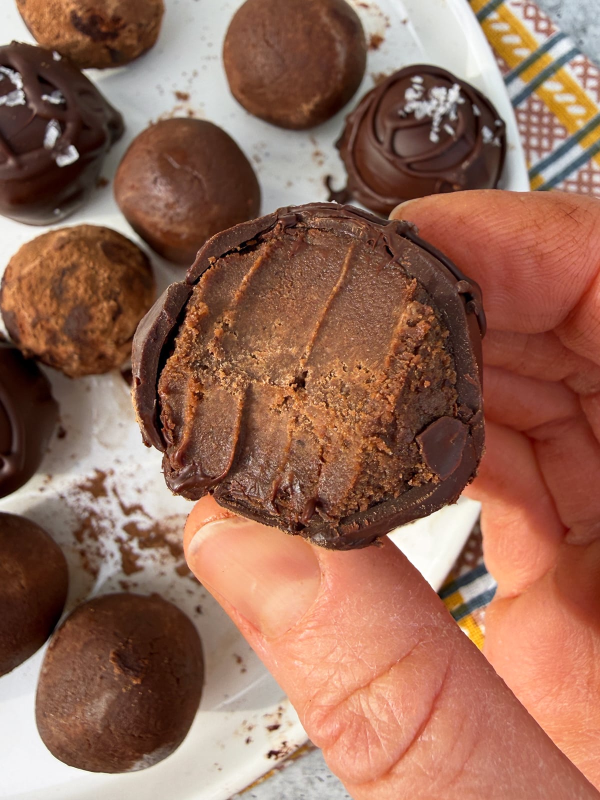 Bite of a protein ball to show the texture.