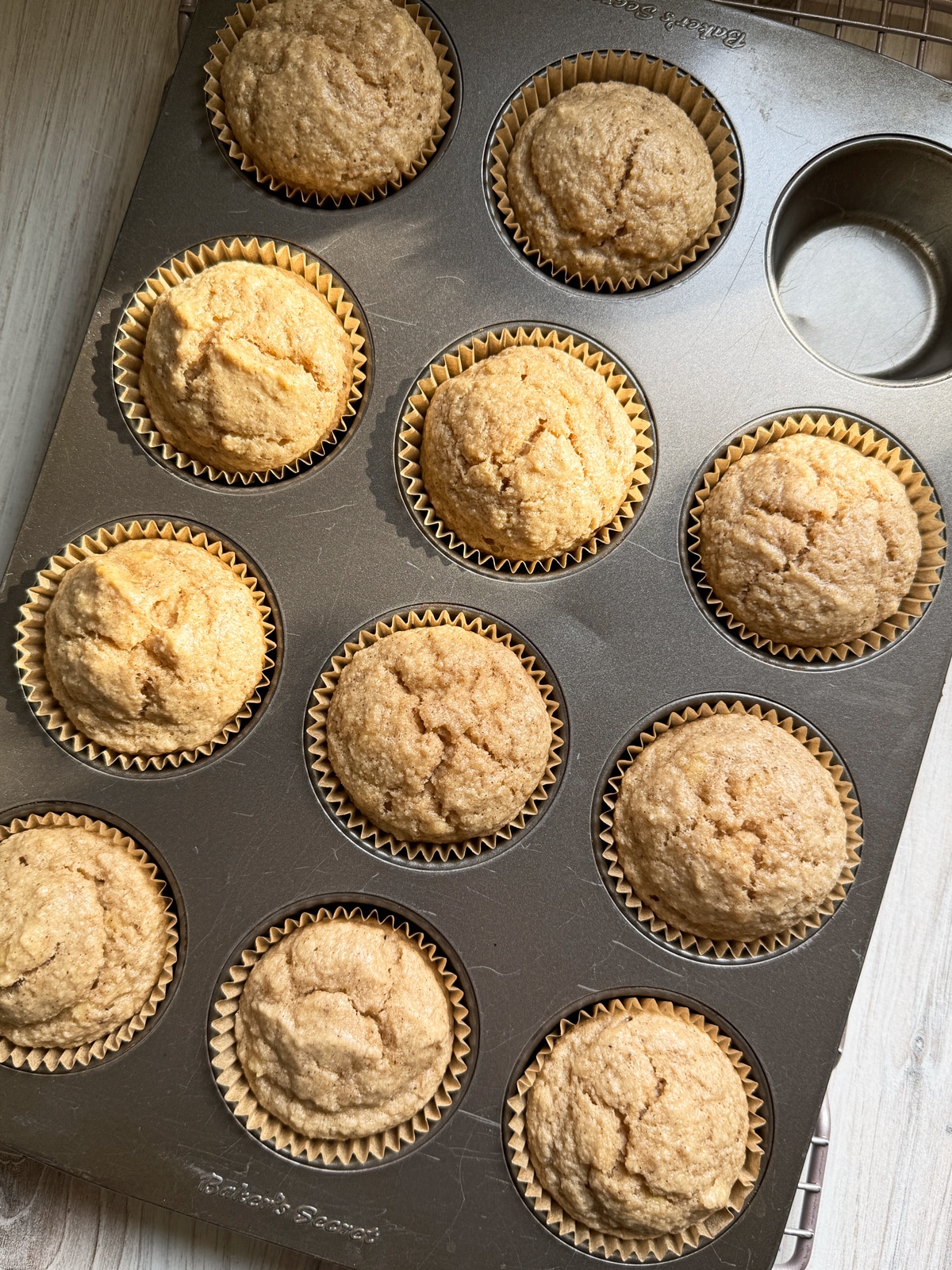 Freshly baked muffins in muffin tin.