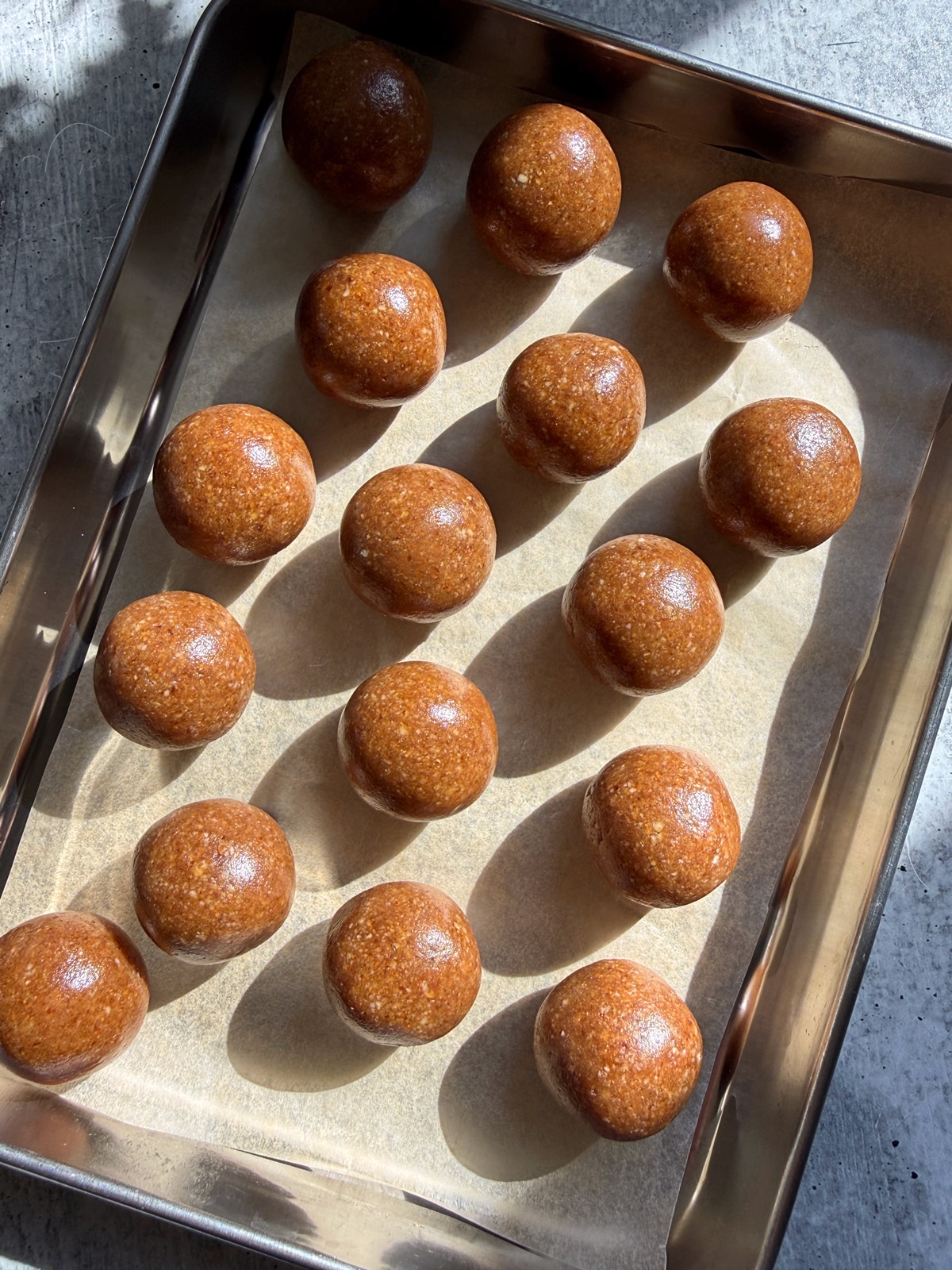 Filling rolled into balls and set on a lined baking sheet.