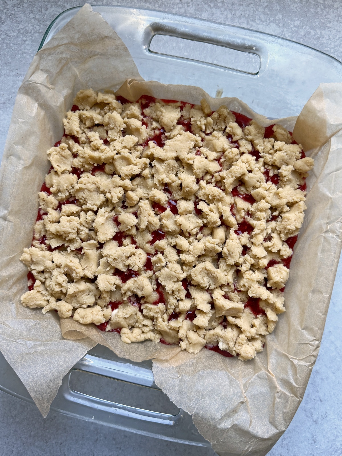 Strawberry crumb bars assembled and ready to bake.