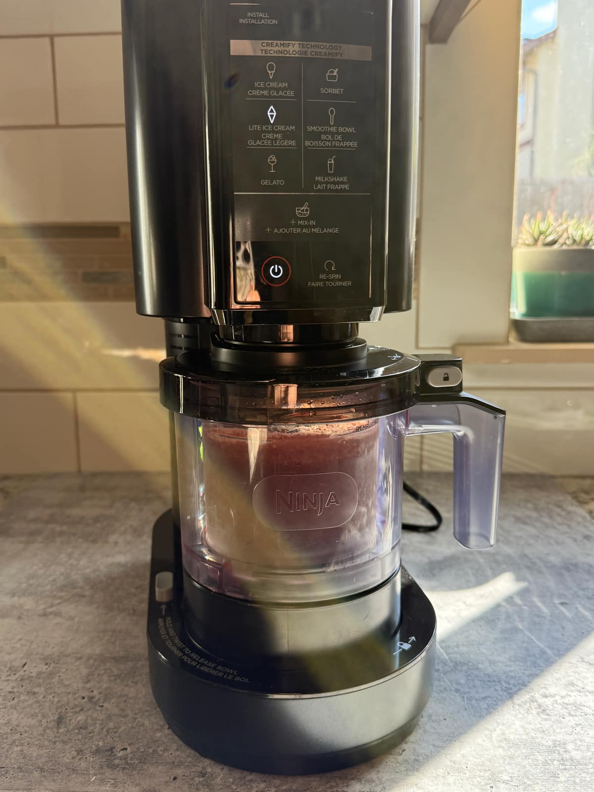 Blending the ice cream in the Ninja Creami.