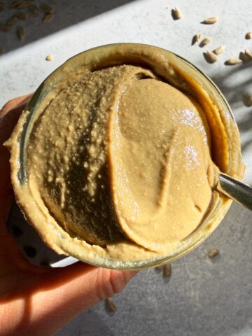 Jar of homemade sunflower seed butter.