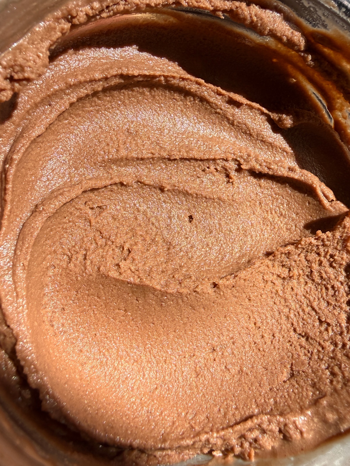 Showing how smooth the ice cream is.