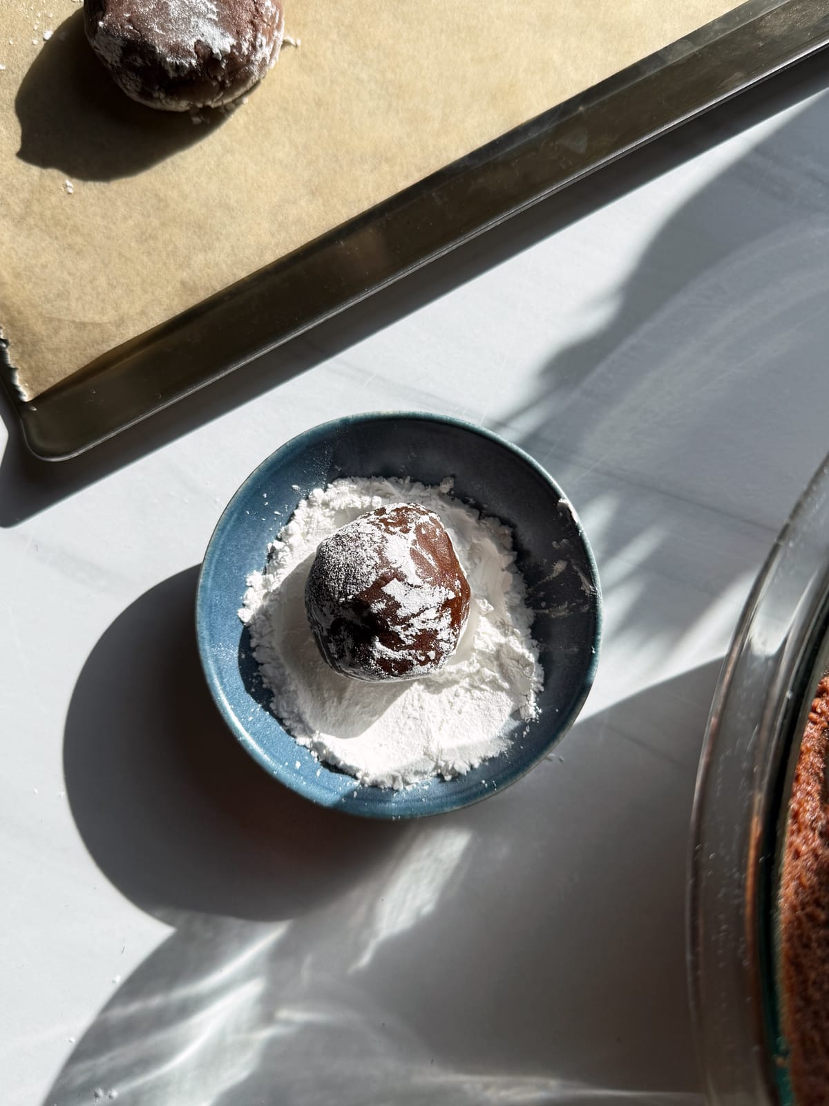 Rolling the dough in tapioca starch.