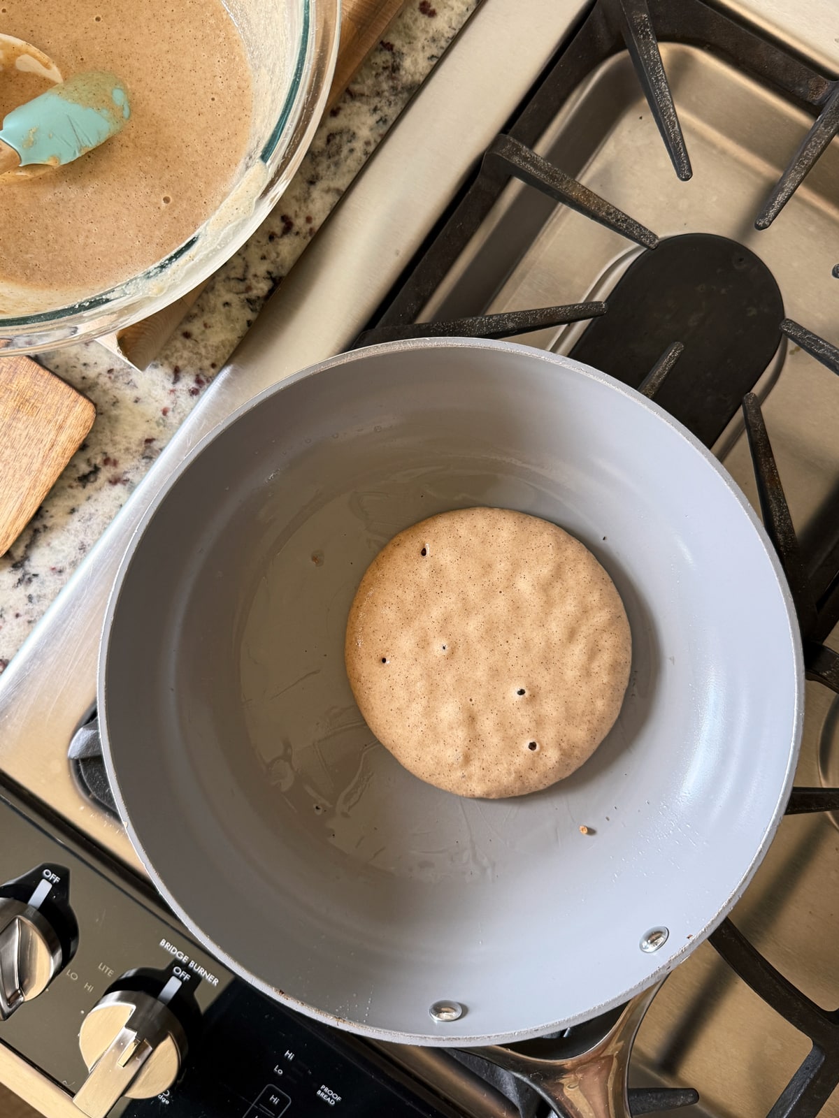 Cooking the pancakes on a ceramic frying pan.