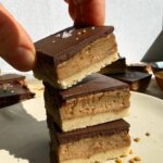 Grabbing a millionaire bar from a stack of 3.