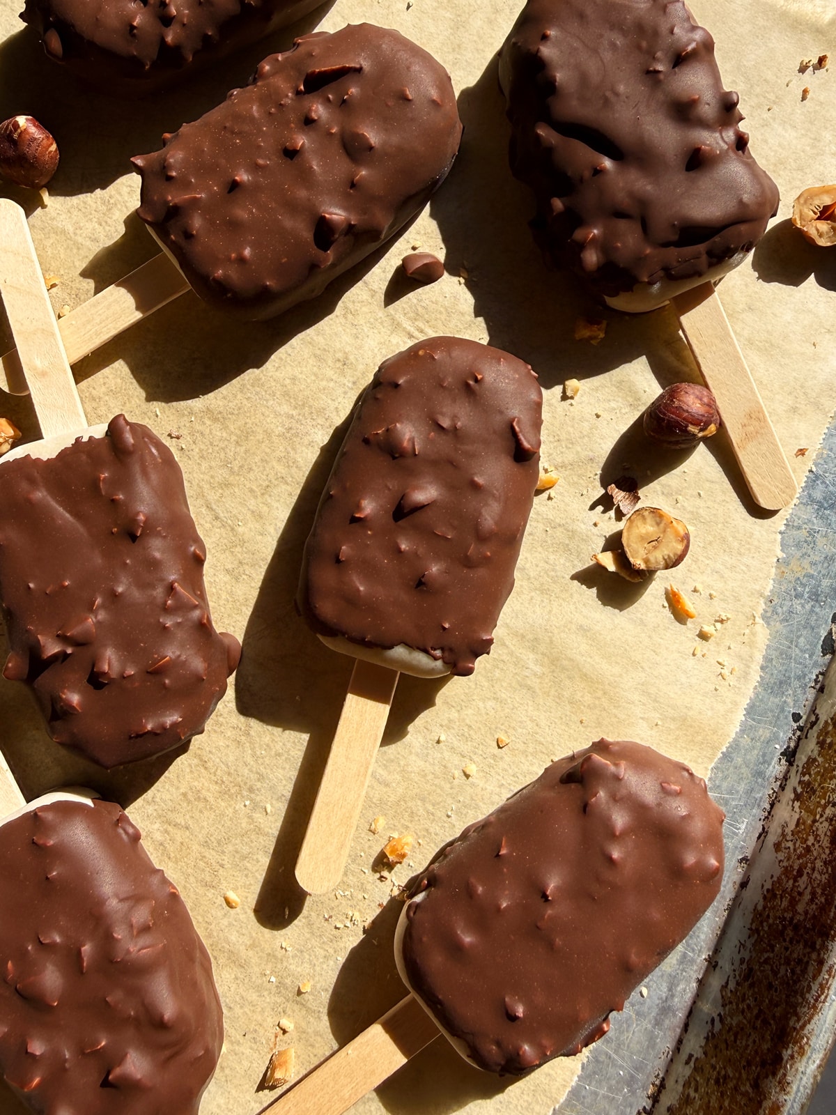 Top down view of bars laying on a parchment-lined baking sheet.