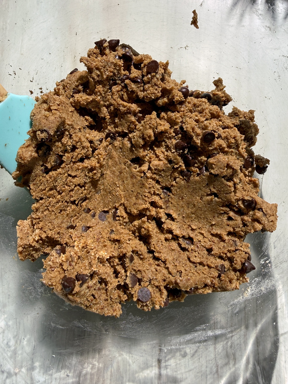 Dough for paleo chocolate chip cookie bars in mixing bowl.