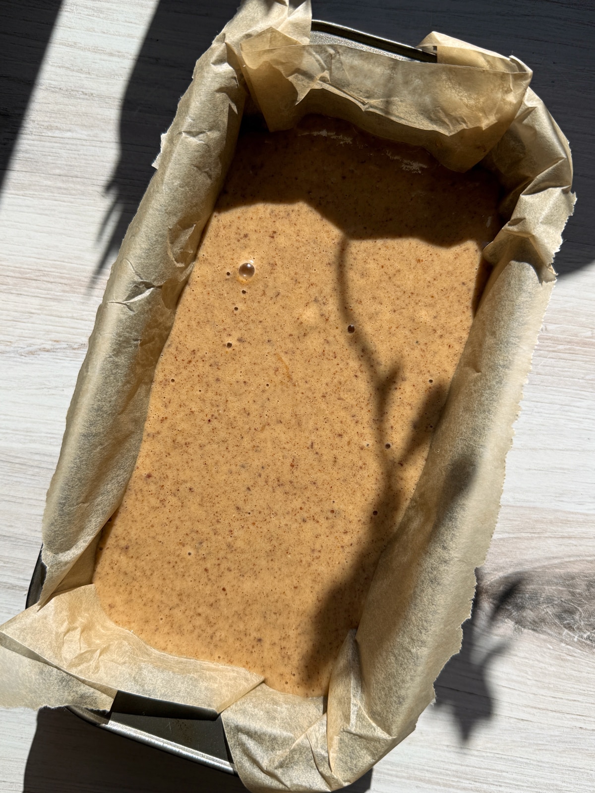Batter in lined loaf pan.