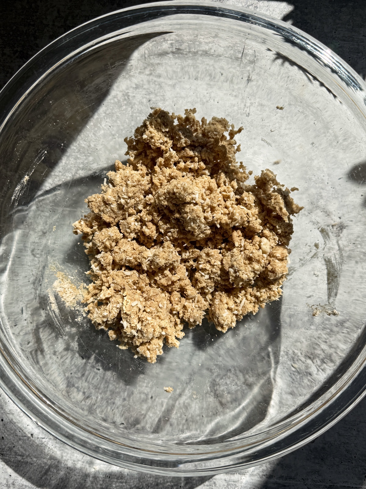 Apple crumble topping in mixing bowl.