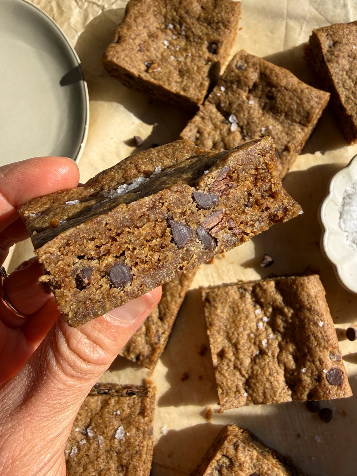 Holding a cookie bar.