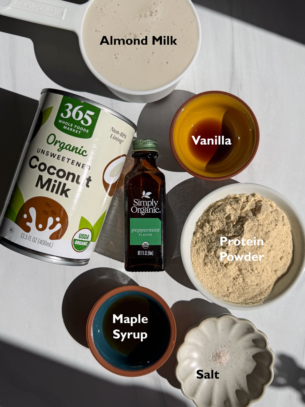 Ingredients needed to make mint protein ice cream in the Ninja Creami machine.