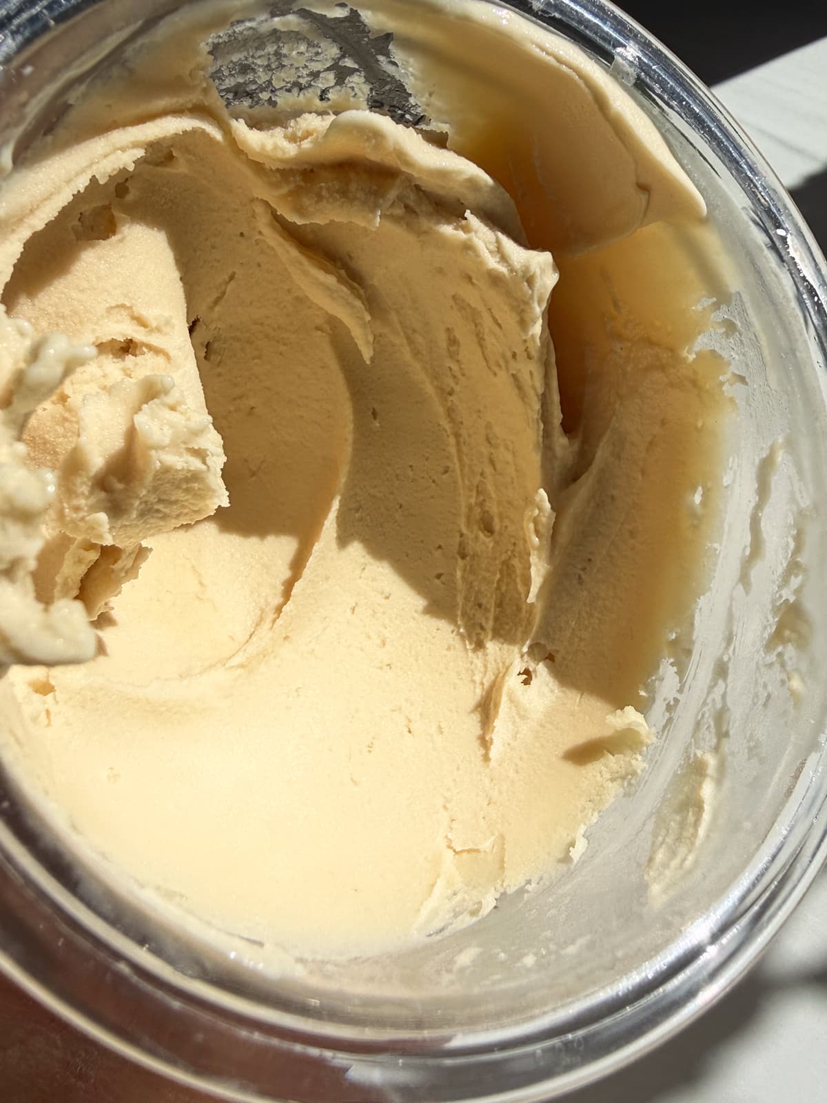 Creamy mint protein ice cream in Ninja Creami pint.
