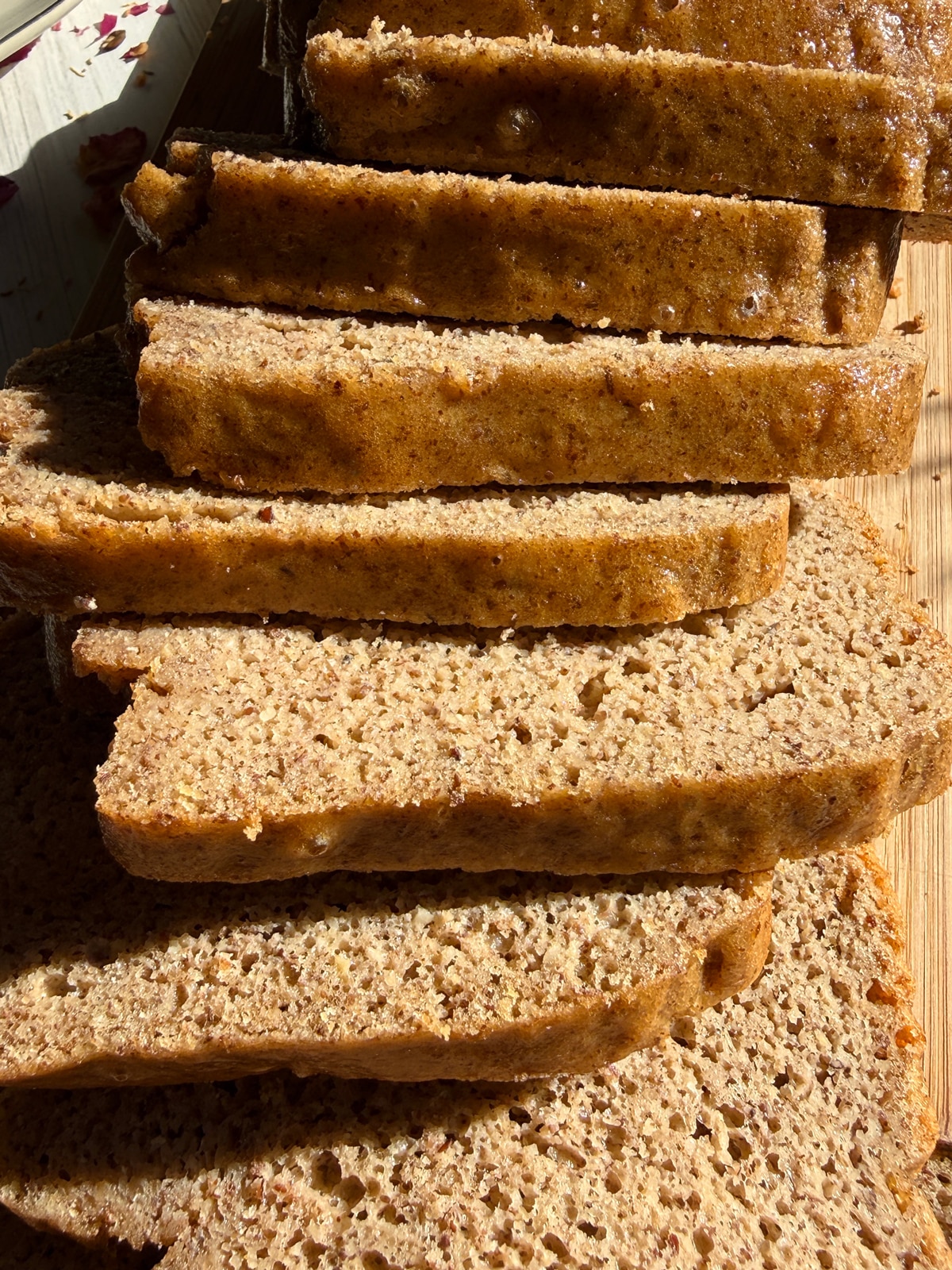 Slices of bread on cutting board.